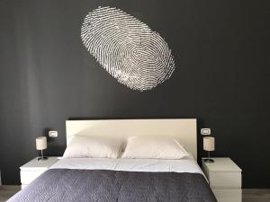 A bed or beds in a room at Sensation House