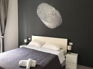A bed or beds in a room at Sensation House