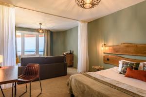 Postel nebo postele na pokoji v ubytování Baya Hotel