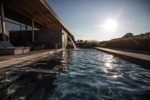 The swimming pool at or close to La Source Des Sens