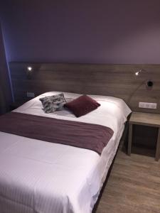Postel nebo postele na pokoji v ubytování L'Hôtel des Bords de L'ill