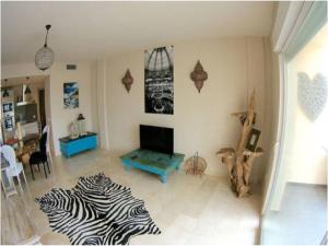 a living room with a zebra rug on the floor at Finca Rosita in Santa Eularia des Riu