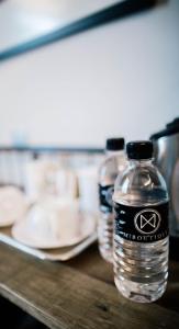 a bottle of water sitting on top of a table at M Boutique Kampar in Kampar