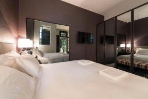 A bed or beds in a room at Deco Gem Aliados