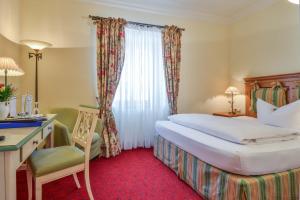 Voodi või voodid majutusasutuse Hotel Post Murnau toas