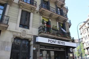 a building with a sign that reads point reyes at Sleep Green - Certified Eco Youth Hostel in Barcelona