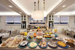 a table filled with lots of different types of food at Hotel Rivage in Sorrento