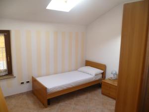 Ένα ή περισσότερα κρεβάτια σε δωμάτιο στο Casa Vacanza Ca dei Logi