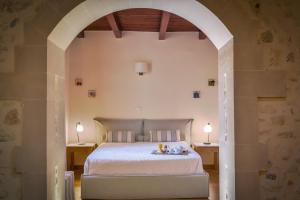 Posteľ alebo postele v izbe v ubytovaní Veneto Boutique Hotel