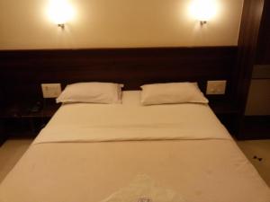Postel nebo postele na pokoji v ubytování Hotel GreenLand-Elegant