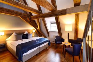 Postel nebo postele na pokoji v ubytování Hotel Alte Vogtei