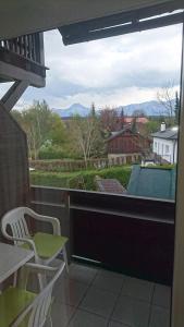 a view of a balcony with a table and chairs at Seepension Smoley in Villach