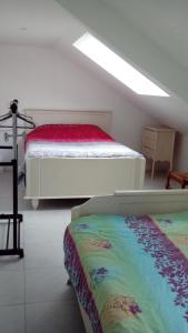 Katil atau katil-katil dalam bilik di Gîte de Blessy
