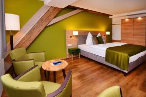Postel nebo postele na pokoji v ubytování Hotel Alte Vogtei