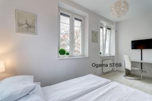 Televízia a/alebo spoločenská miestnosť v ubytovaní Twój Salon-Apartamenty Stare Miasto