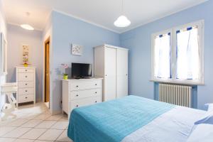 A bed or beds in a room at Residence Kimba