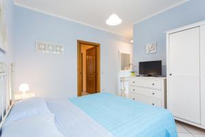 A bed or beds in a room at Residence Kimba