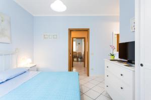 A bed or beds in a room at Residence Kimba