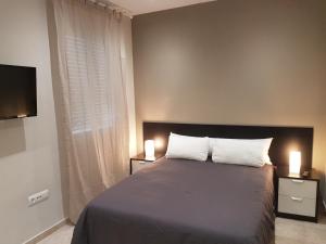 Cama o camas de una habitación en Vivienda Reina Victoria