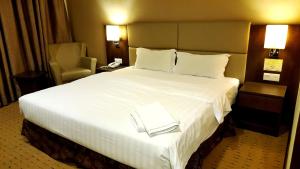 Ένα ή περισσότερα κρεβάτια σε δωμάτιο στο Lintas View Hotel
