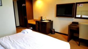 Ένα ή περισσότερα κρεβάτια σε δωμάτιο στο Lintas View Hotel