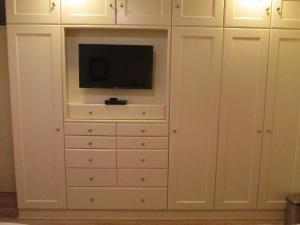 TV o dispositivi per l'intrattenimento presso Kangaroo Wasi Airport Bed & Breakfast