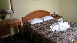Postel nebo postele na pokoji v ubytování Hotel Tukums