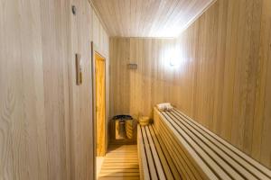 a sauna with a wooden floor and a hallway at White Olive Villa in Herceg-Novi