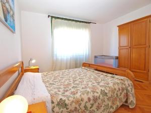 Ein Bett oder Betten in einem Zimmer der Unterkunft Apartments Duilija 1301