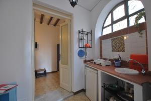 a bathroom with a sink and a window at Vulcanoconsult Appartamenti Spiaggia in Lipari