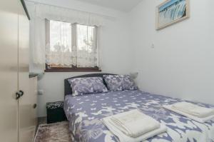 Postel nebo postele na pokoji v ubytování Zora Apartment