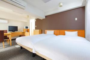 TV a/nebo společenská místnost v ubytování FLEXSTAY INN Shirogane + 6 fotografií