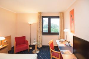 Postel nebo postele na pokoji v ubytování Montana Parkhotel Marl