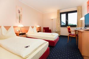 Postel nebo postele na pokoji v ubytování Montana Parkhotel Marl + 29 fotografií