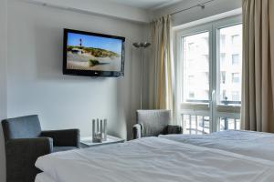 TV a/nebo společenská místnost v ubytování Hotel Uthland