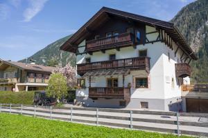 a house with balconies on the side of it at Gästehaus Huber in Mayrhofen
