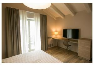 TV a/nebo společenská místnost v ubytování Ca' Barbini Resort