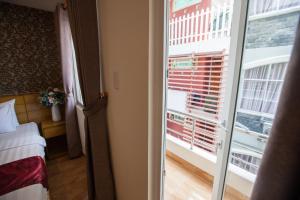 Postel nebo postele na pokoji v ubytování Ailen Garden 2 Hotel