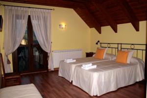 Postel nebo postele na pokoji v ubytování Hostal Rural Casa Parda
