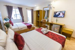 Postel nebo postele na pokoji v ubytování Ailen Garden 2 Hotel