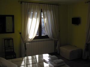 Postel nebo postele na pokoji v ubytování Hostal Rural Casa Parda