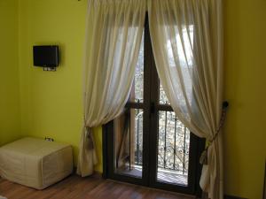 TV a/nebo společenská místnost v ubytování Hostal Rural Casa Parda