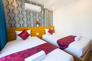 Postel nebo postele na pokoji v ubytování Ailen Garden 2 Hotel