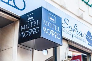 a sign for a motelocooco on the side of a building at Motel Korzo in Bihać