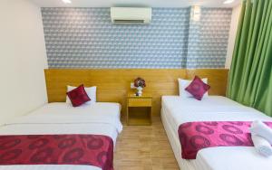 Postel nebo postele na pokoji v ubytování Ailen Garden 2 Hotel