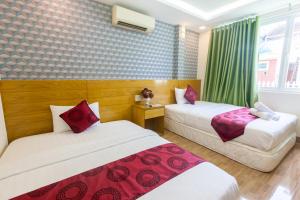 Postel nebo postele na pokoji v ubytování Ailen Garden 2 Hotel