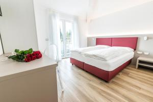 Rúm í herbergi á Albergo Garni Francesco