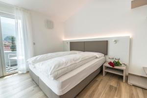 Rúm í herbergi á Albergo Garni Francesco