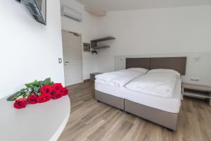 Rúm í herbergi á Albergo Garni Francesco