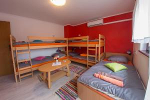 Postel nebo postele na pokoji v ubytování Guesthouse Adi